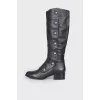Black boots with gold hardware