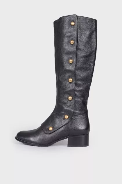 Black boots with gold hardware