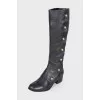 Black boots with gold hardware