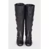 Black boots with gold hardware