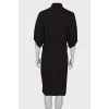 Dress with a high collar, on the belt