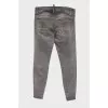 Gray jeans with paint stain effect