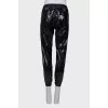 Patent black trousers