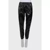 Patent black trousers