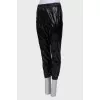 Patent black trousers