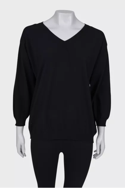 Black V-neck jumper with tag