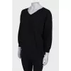 Black V-neck jumper with tag