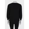 Black V-neck jumper with tag