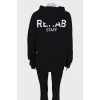 Black hoodie with brand logo