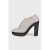 Gray perforated ankle boots