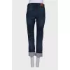 Ripped effect jeans with tag