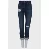 Dark blue jeans with a tag