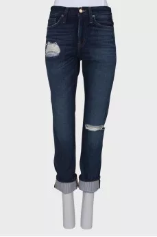 Dark blue jeans with a tag