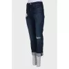 Dark blue jeans with a tag