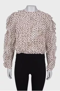 Polka dot blouse with ruffles