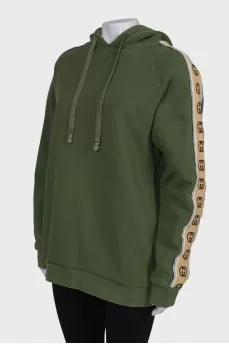 Green hoodie with brand logo