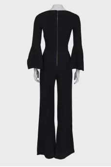 Black jumpsuit close-fitting in the waist