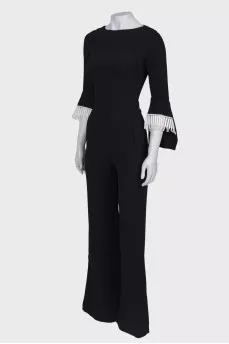 Black jumpsuit close-fitting in the waist