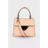 Powder colored leather bag