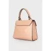 Powder colored leather bag