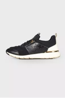 Black and white sneakers with brand logo