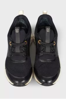Black and white sneakers with brand logo