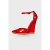 Red patent leather pumps
