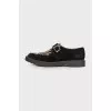 Black loafers with pony skin