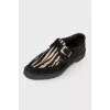 Black loafers with pony skin
