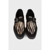 Black loafers with pony skin