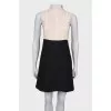Black and beige pleated dress