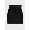 Black skirt with golden buttons