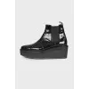 Patent leather wedge boots