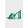 Lacquered sandals with curly heels