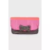 Textile clutch with a bow