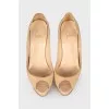 Beige patent leather pumps