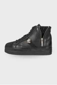 Black boots decorated with rhinestones