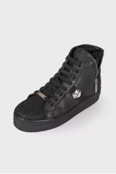 Black boots decorated with rhinestones