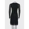 Dress with a decorated seam
