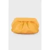 Draped leather clutch