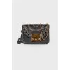 Perforated leather bag