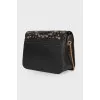 Perforated leather bag