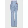 Light blue jeans with slits at the waist