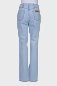 Light blue jeans with slits at the waist