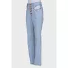 Light blue jeans with slits at the waist