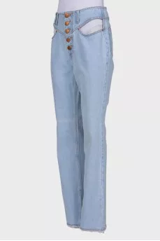 Light blue jeans with slits at the waist