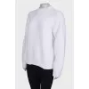 Knitted white sweater