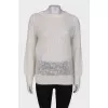 White knitted sweater