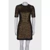 Dress is decorated with sequins
