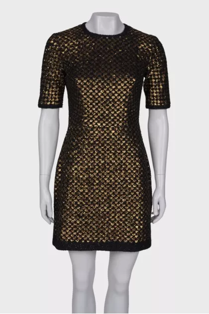 Dress is decorated with sequins